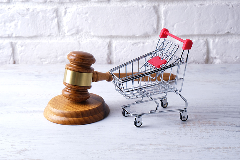 gavel next to shopping cart