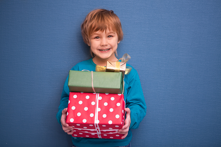 stock image of kid holding a present