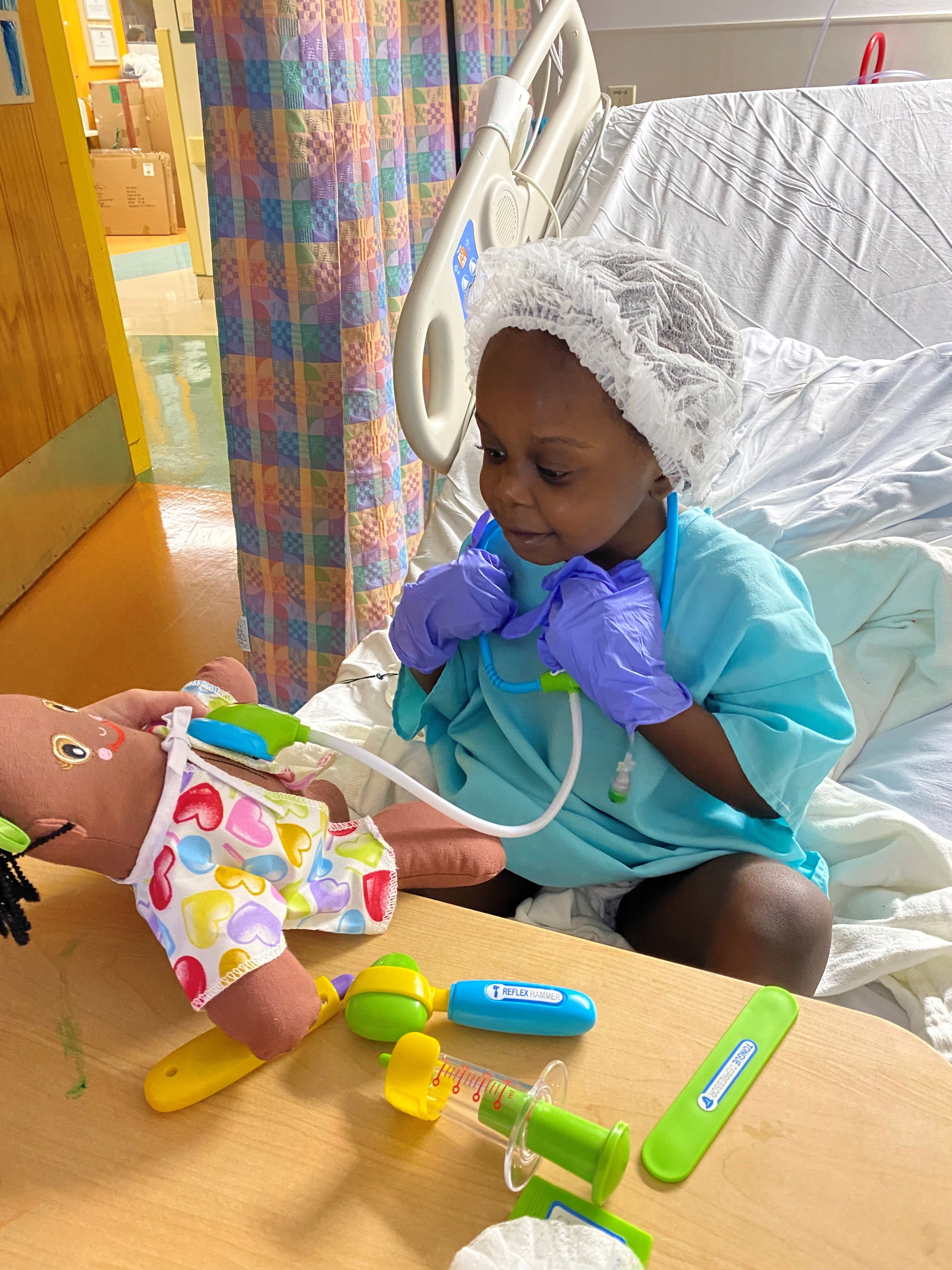 pediatric patient playing with a toy